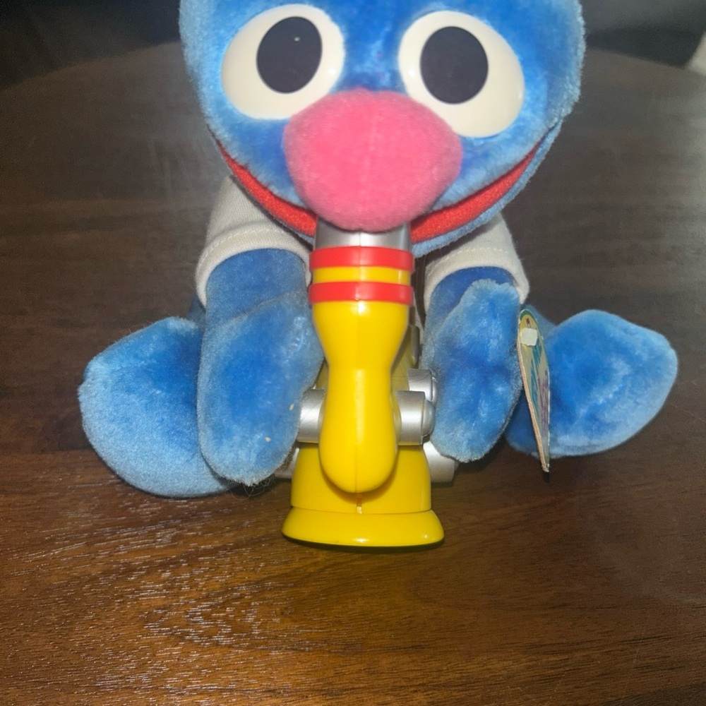 Sesame Street Blue and Yellow Stuffed Animal with Saxophone